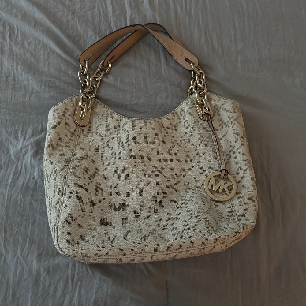 Used Authentic Michael Kors purse off white/gold colored